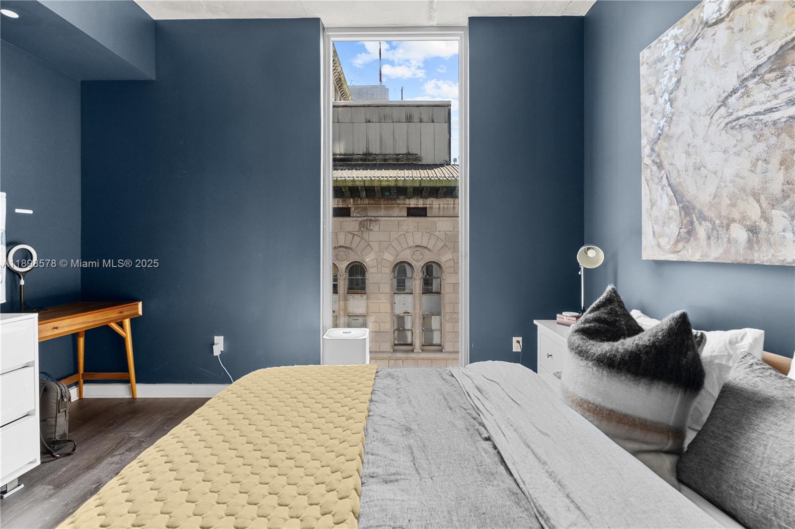 151 Southeast 1st Street, Unit 1402 Miami, FL 33131 - Photo 4 of 16 a bedroom with a bed and window