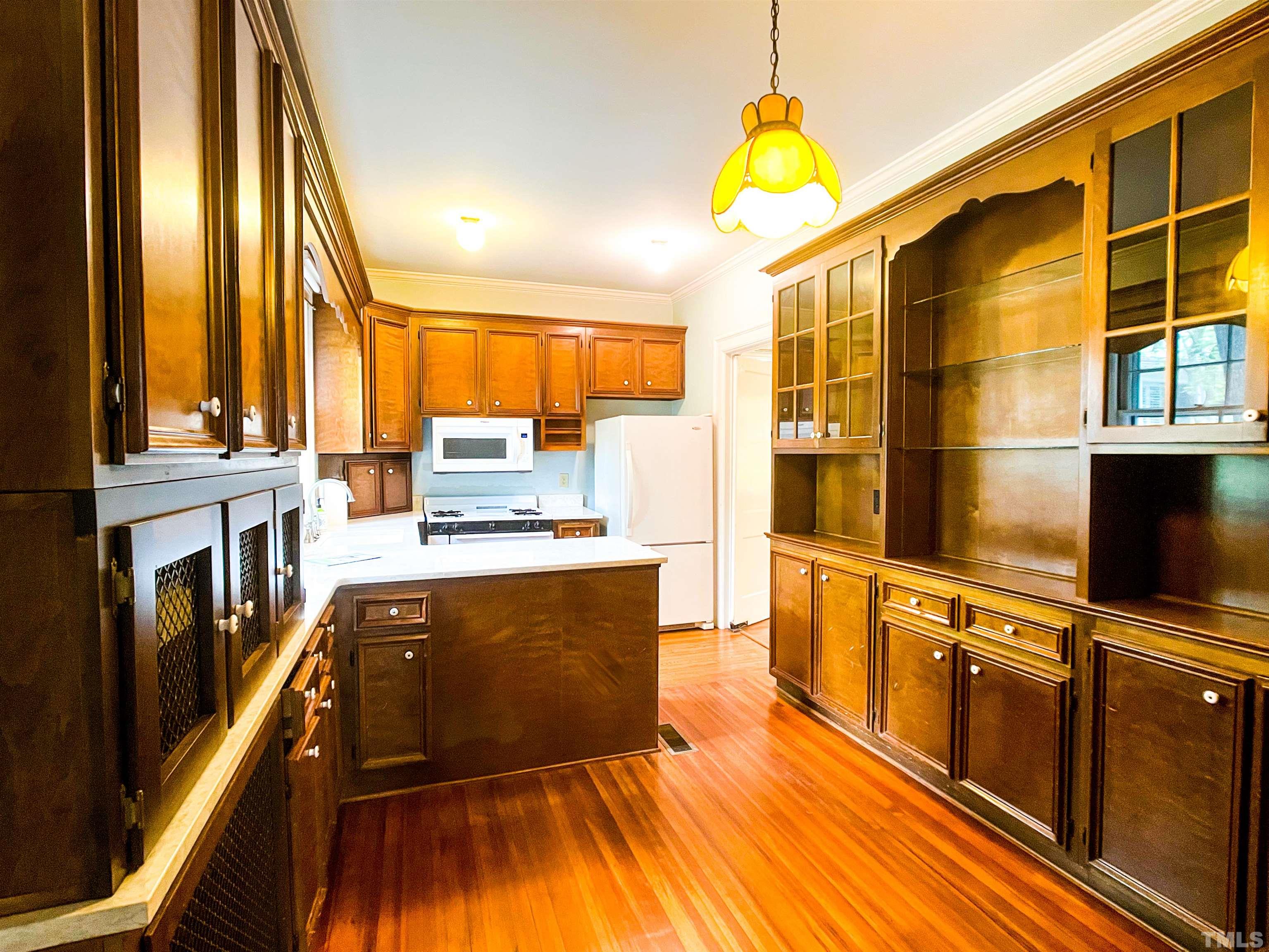 205 Woodburn Road Raleigh, NC 27605 - Photo 11 of 42 a kitchen with stainless steel appliances a stove a sink and a refrigerator