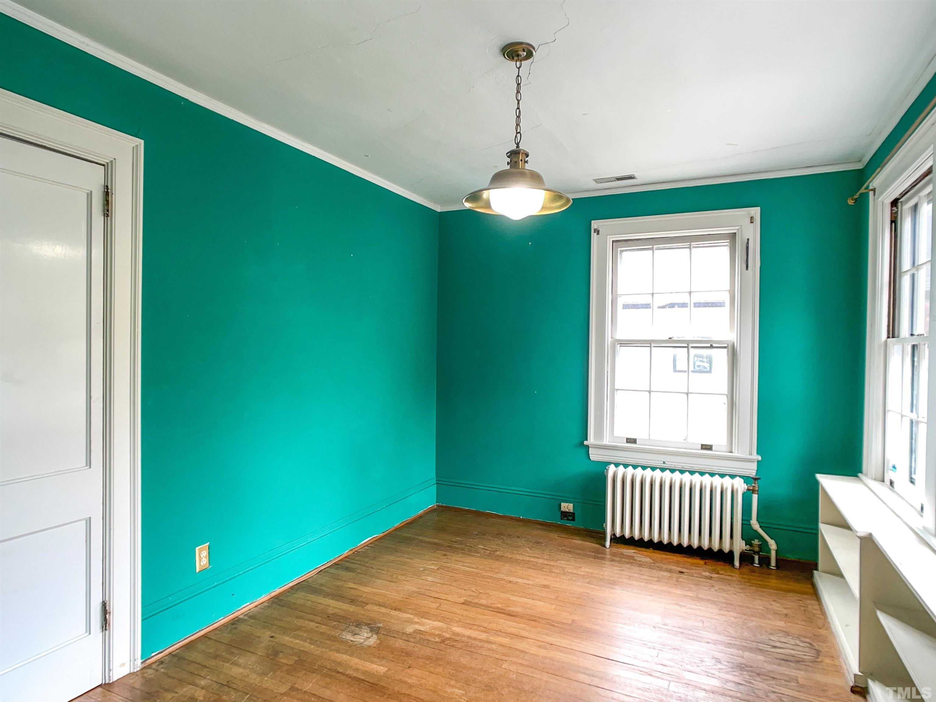 205 Woodburn Road Raleigh, NC 27605 - Photo 19 of 42 a view of empty room with a window and fireplace