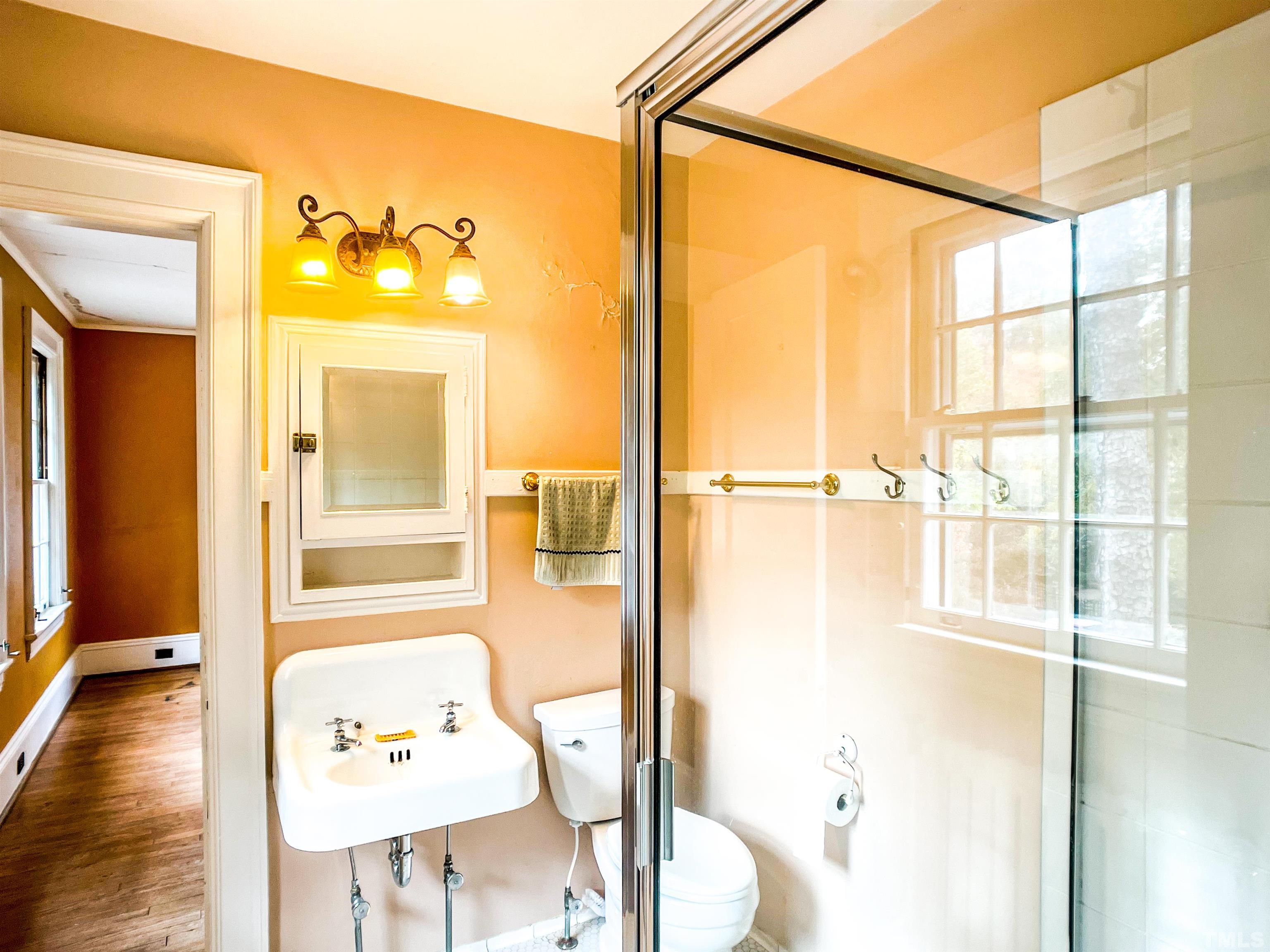 205 Woodburn Road Raleigh, NC 27605 - Photo 26 of 42 a bathroom with a tub and shower