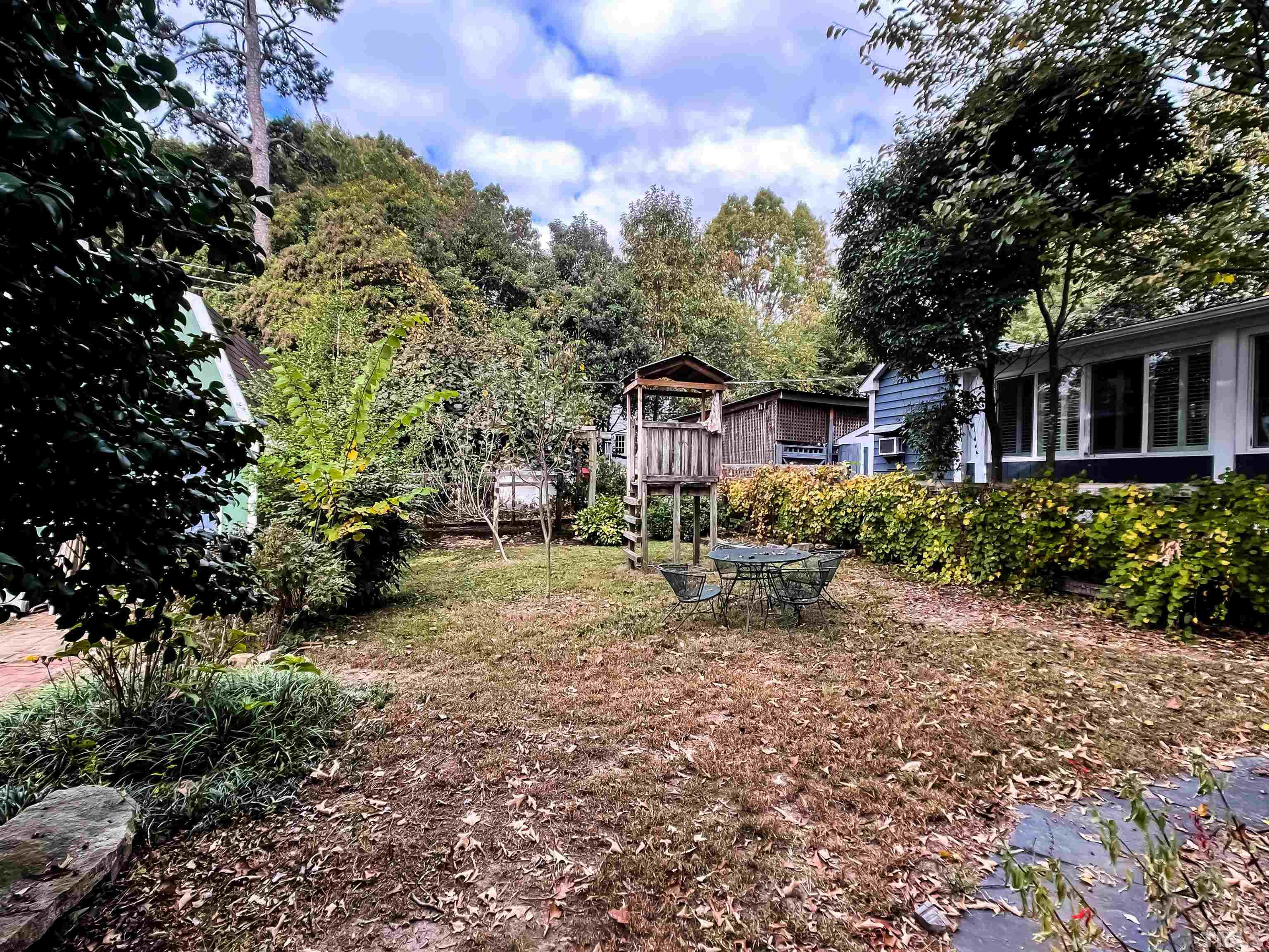 205 Woodburn Road Raleigh, NC 27605 - Photo 32 of 42 a view of a house with a yard and tree s