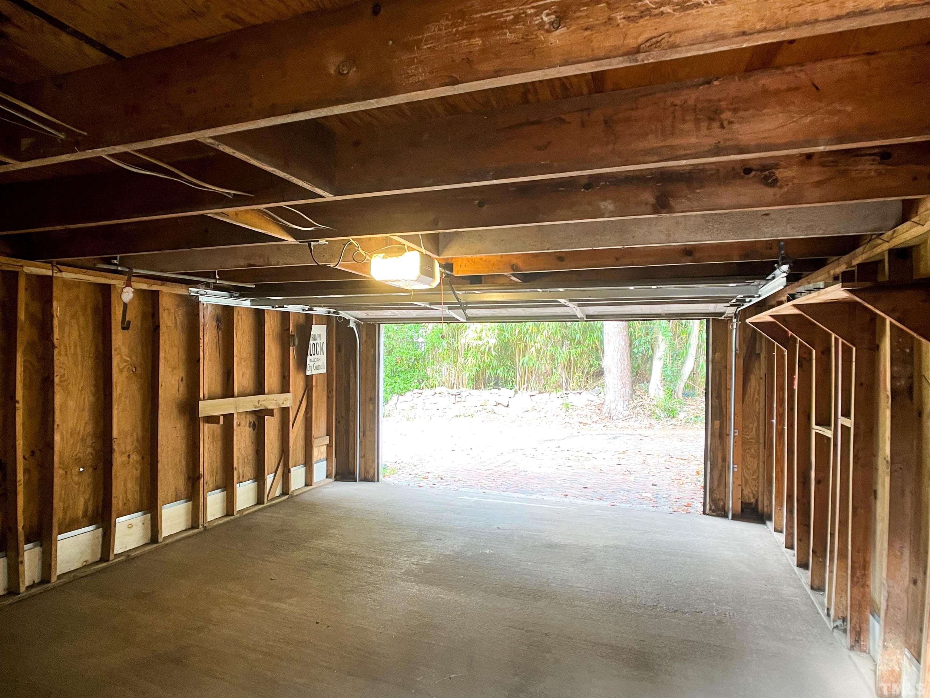 205 Woodburn Road Raleigh, NC 27605 - Photo 39 of 42 a view of an empty room with a windows and stairs