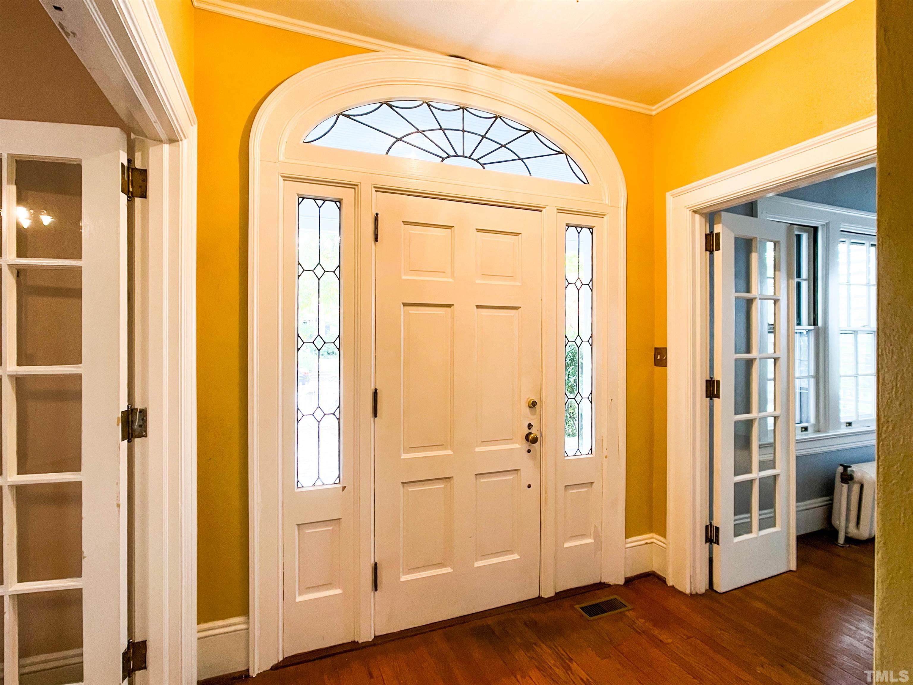 205 Woodburn Road Raleigh, NC 27605 - Photo 5 of 42 a view of front door with wooden floor