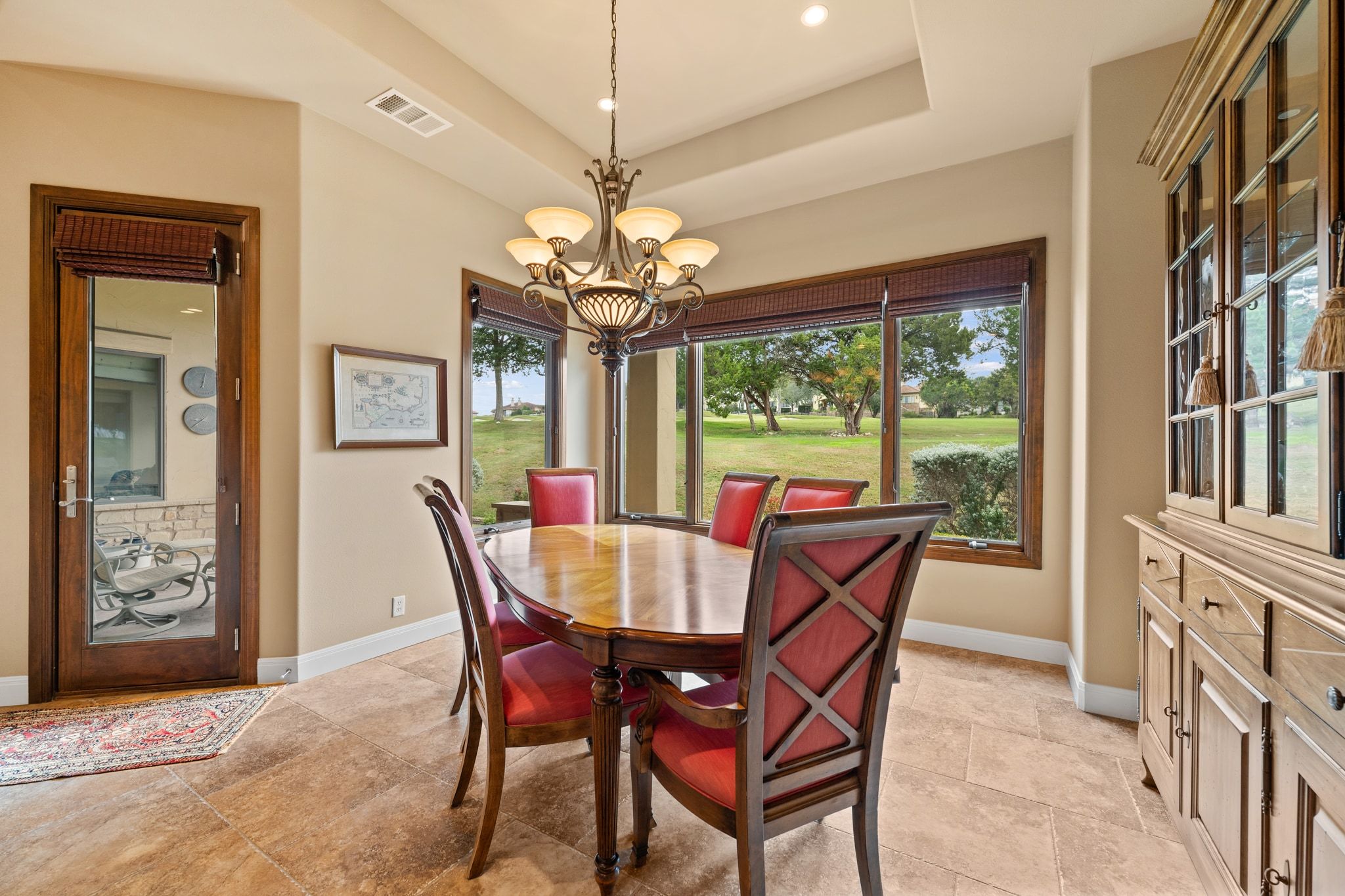 14 Borello Drive, Unit 14 Austin, TX 78738 - Photo 12 of 33 a view of a dining room with furniture a chandelier and large window