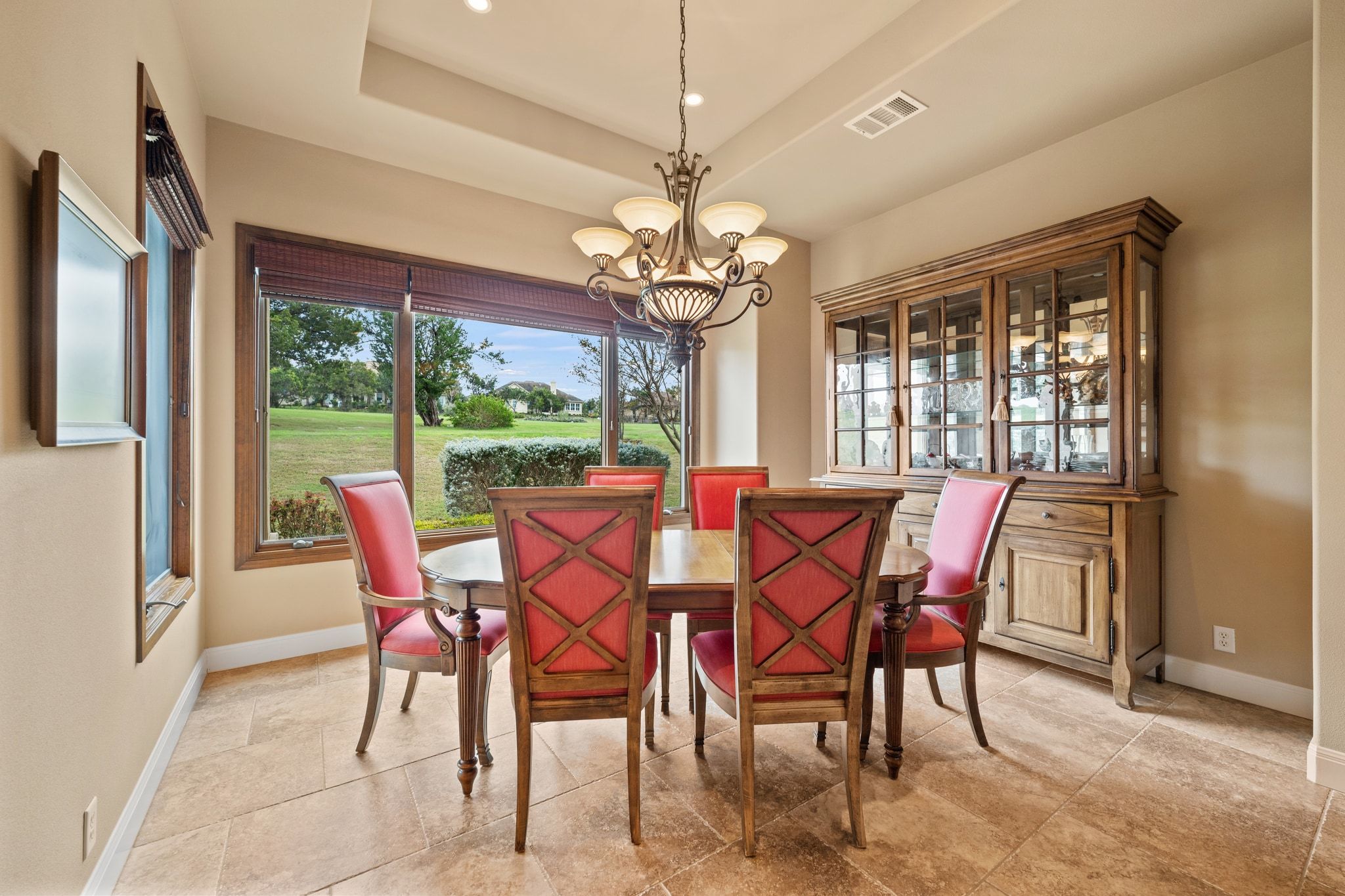 14 Borello Drive, Unit 14 Austin, TX 78738 - Photo 13 of 33 a view of a dining room with furniture a chandelier and large windows