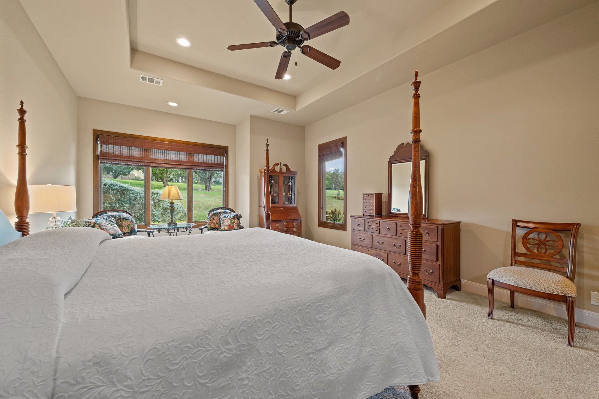 14 Borello Drive, Unit 14 Austin, TX 78738 - Photo 15 of 33 a bed room with a bed and a chandelier