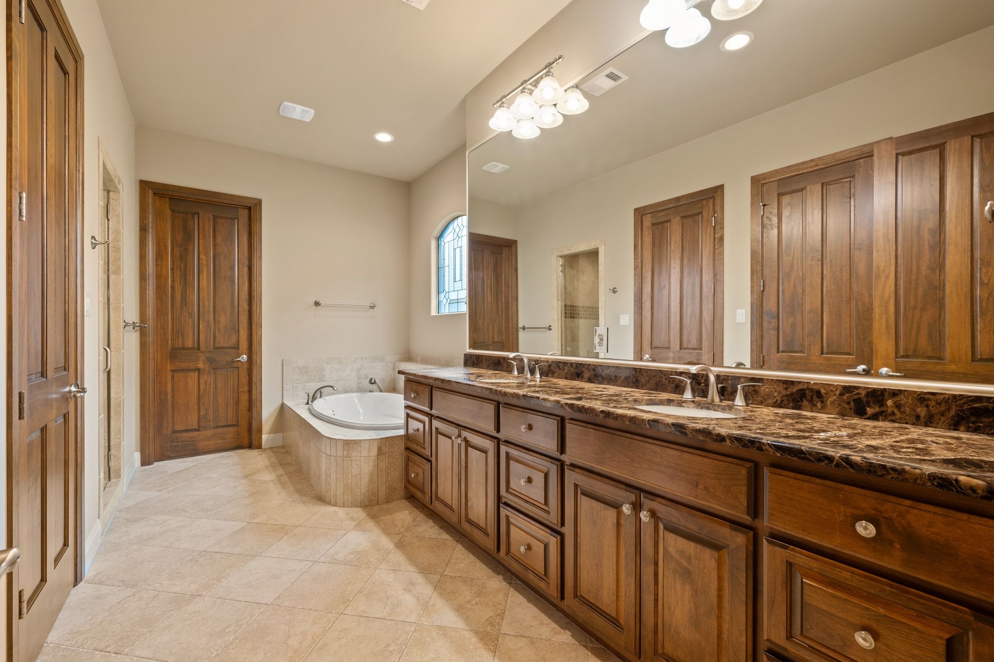 14 Borello Drive, Unit 14 Austin, TX 78738 - Photo 18 of 33 a spacious bathroom with a double vanity sink mirror and toilet