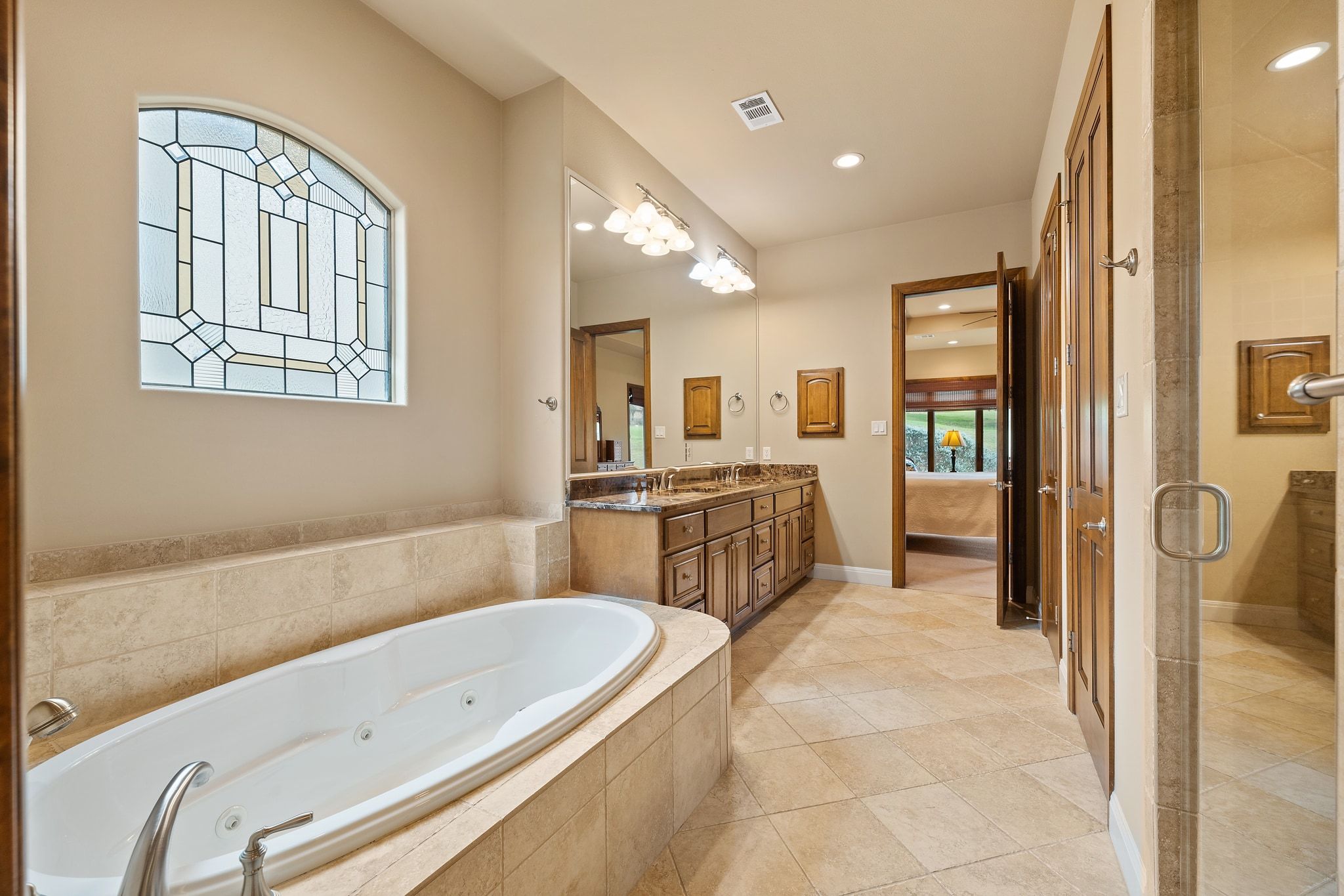 14 Borello Drive, Unit 14 Austin, TX 78738 - Photo 19 of 33 a bathroom with a tub sink shower and mirror