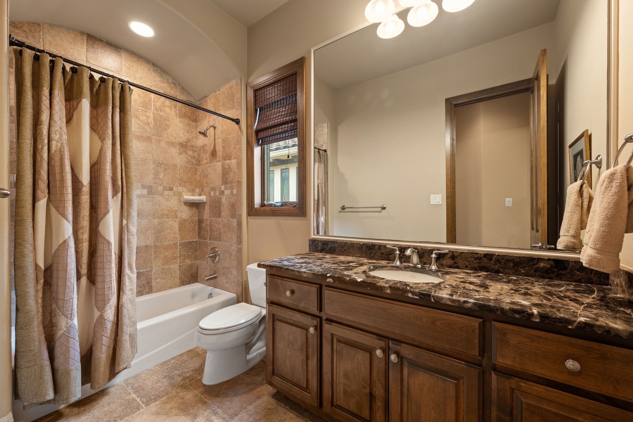 14 Borello Drive, Unit 14 Austin, TX 78738 - Photo 24 of 33 a bathroom with a granite countertop sink toilet and shower