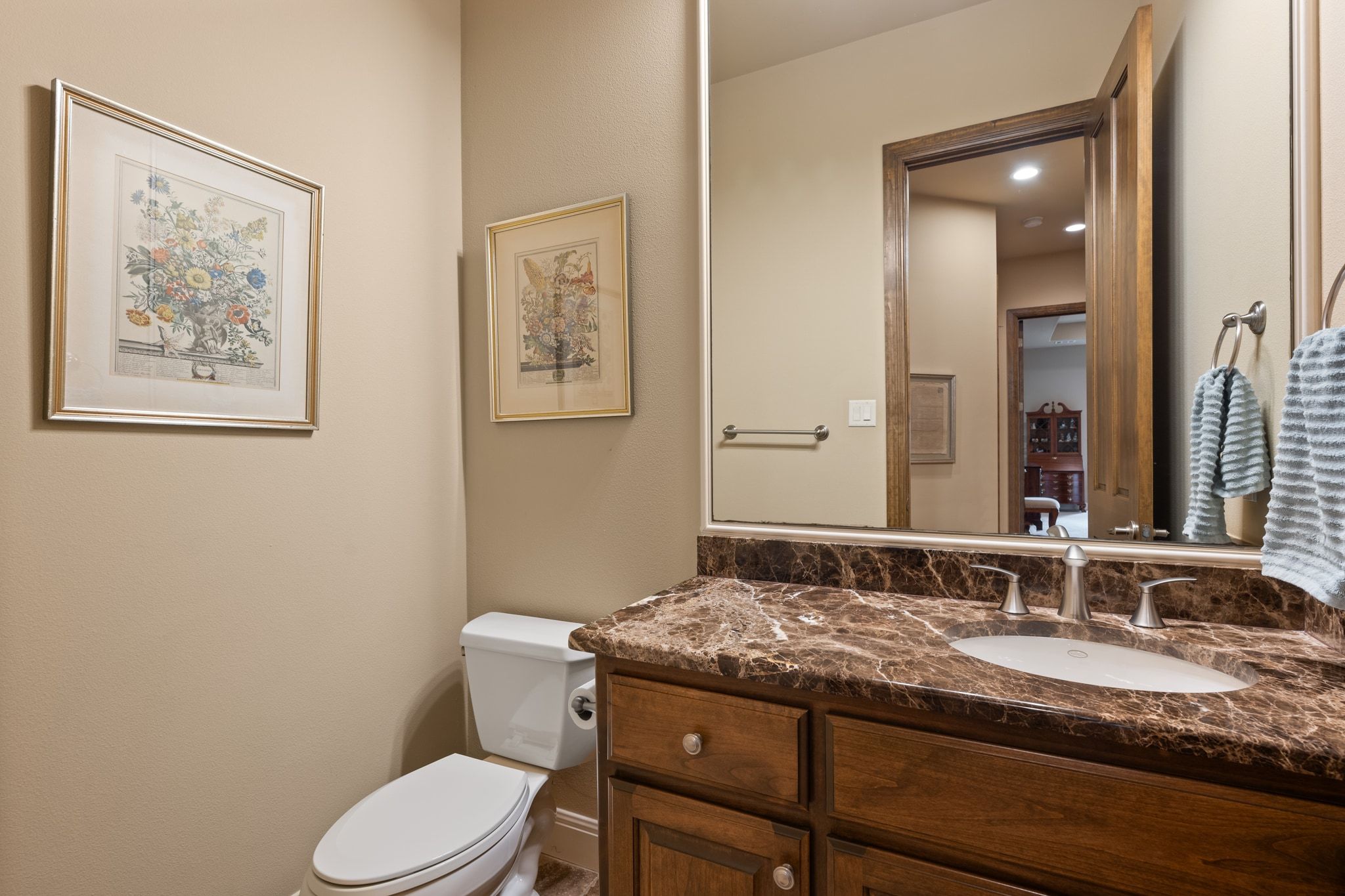 14 Borello Drive, Unit 14 Austin, TX 78738 - Photo 25 of 33 a bathroom with a granite countertop toilet sink and mirror
