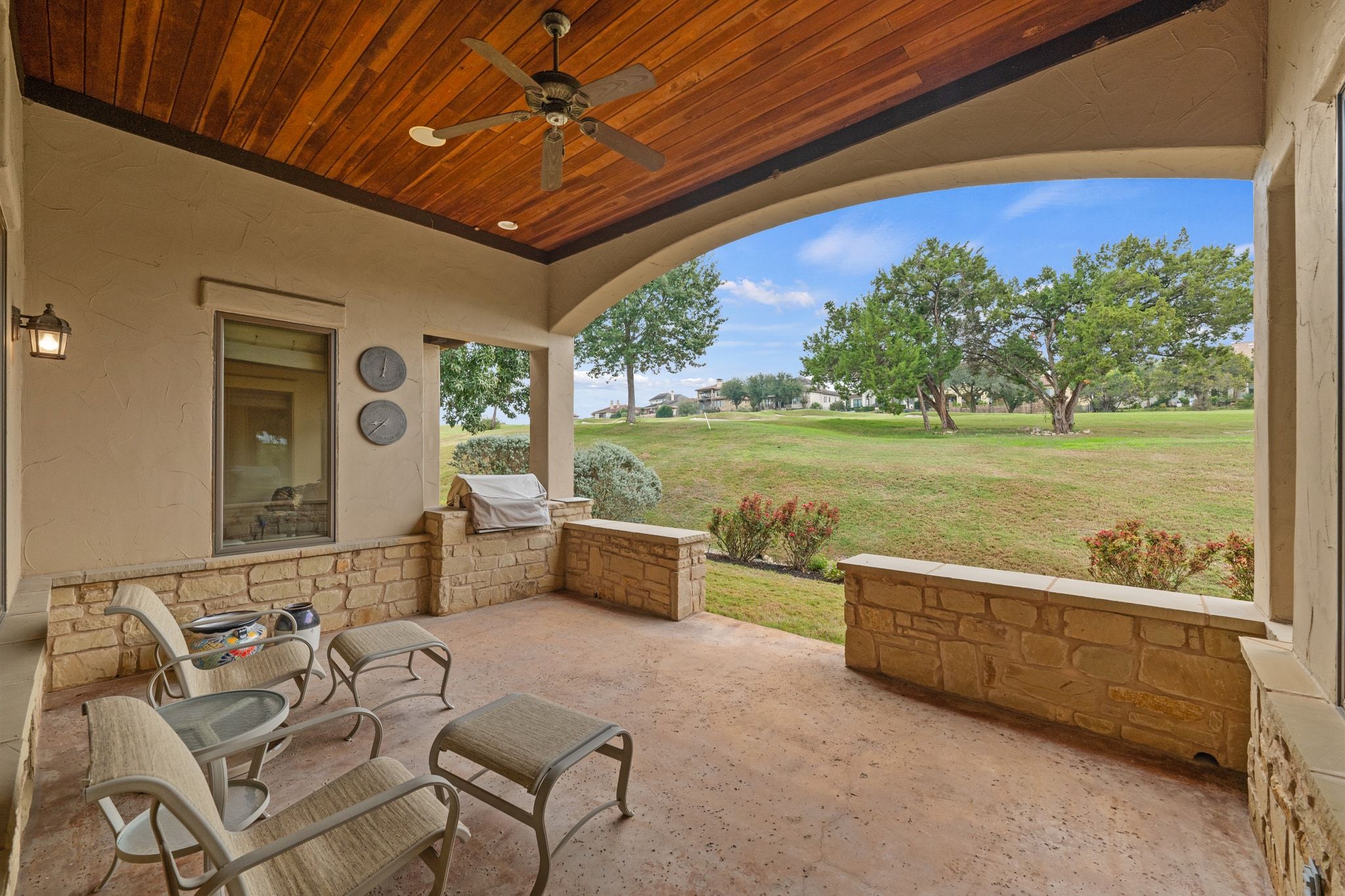 14 Borello Drive, Unit 14 Austin, TX 78738 - Photo 28 of 33 a view of a chairs and table in patio with a yard