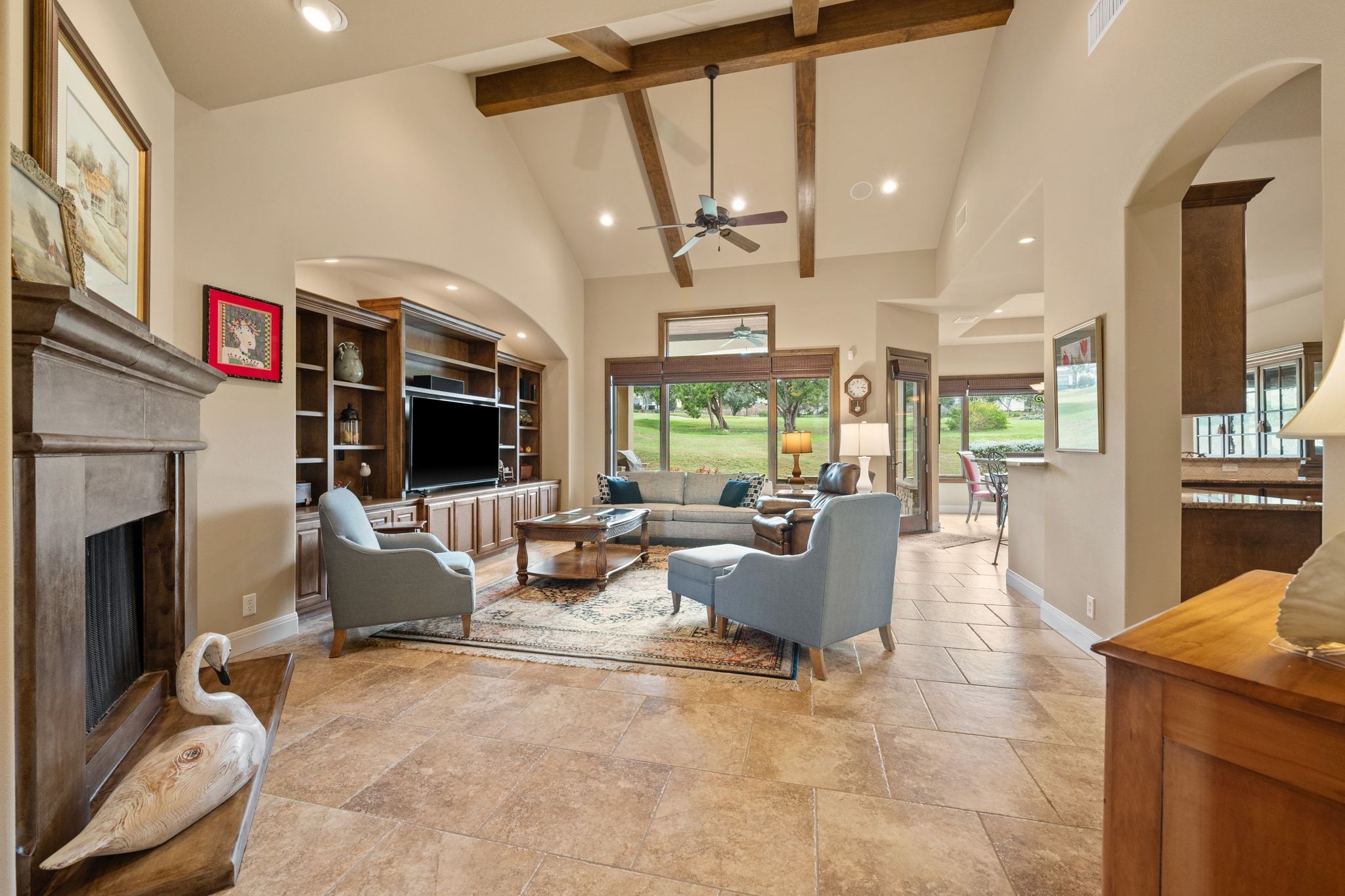 14 Borello Drive, Unit 14 Austin, TX 78738 - Photo 3 of 33 a living room with fireplace furniture and a large window
