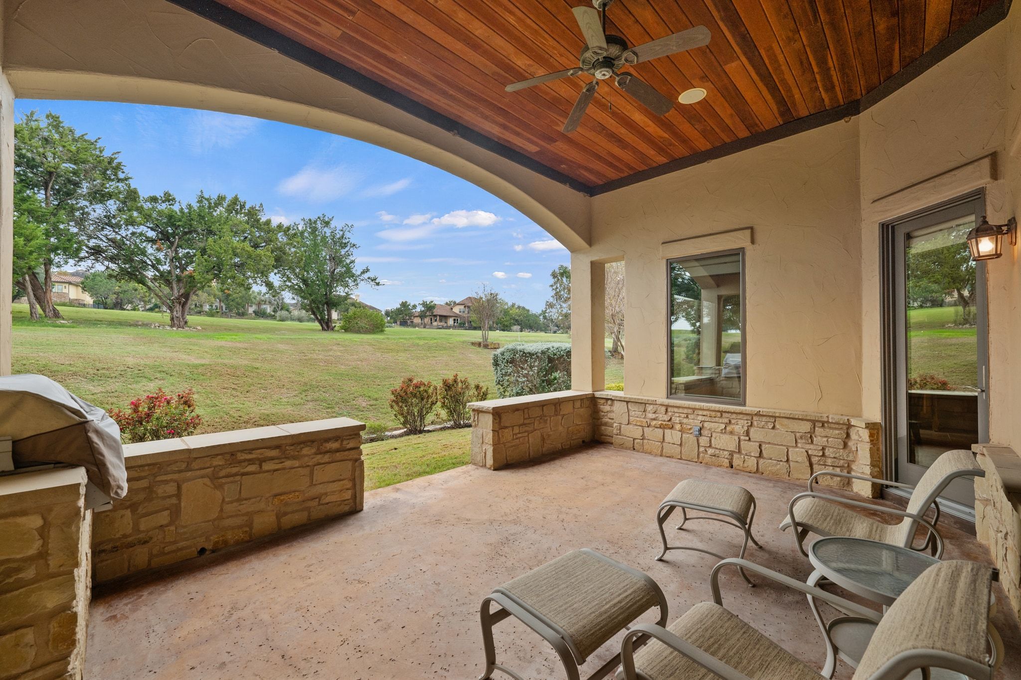 14 Borello Drive, Unit 14 Austin, TX 78738 - Photo 31 of 33 a balcony with furniture and a garden