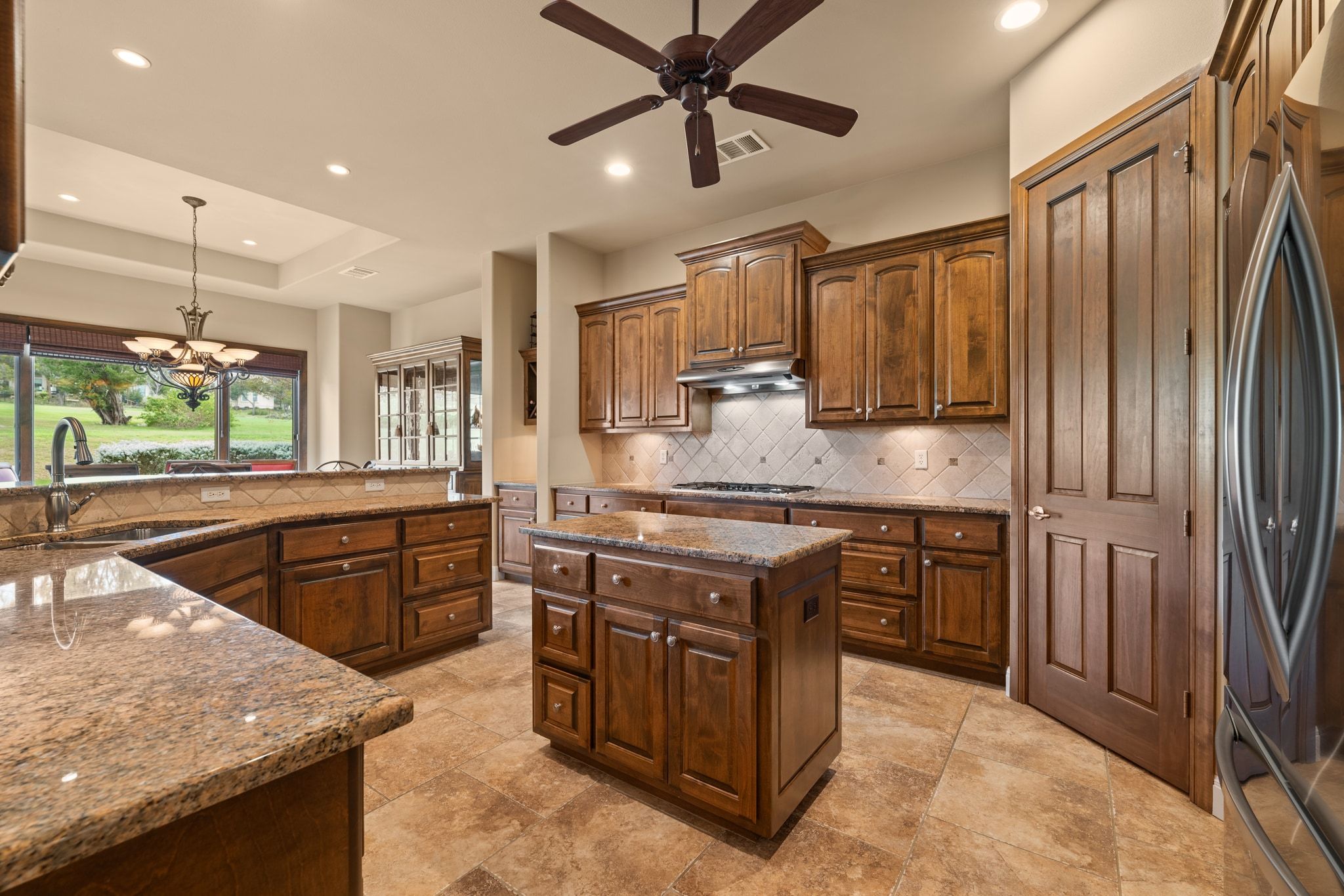 14 Borello Drive, Unit 14 Austin, TX 78738 - Photo 4 of 33 a kitchen with stainless steel appliances granite countertop a sink stove and refrigerator