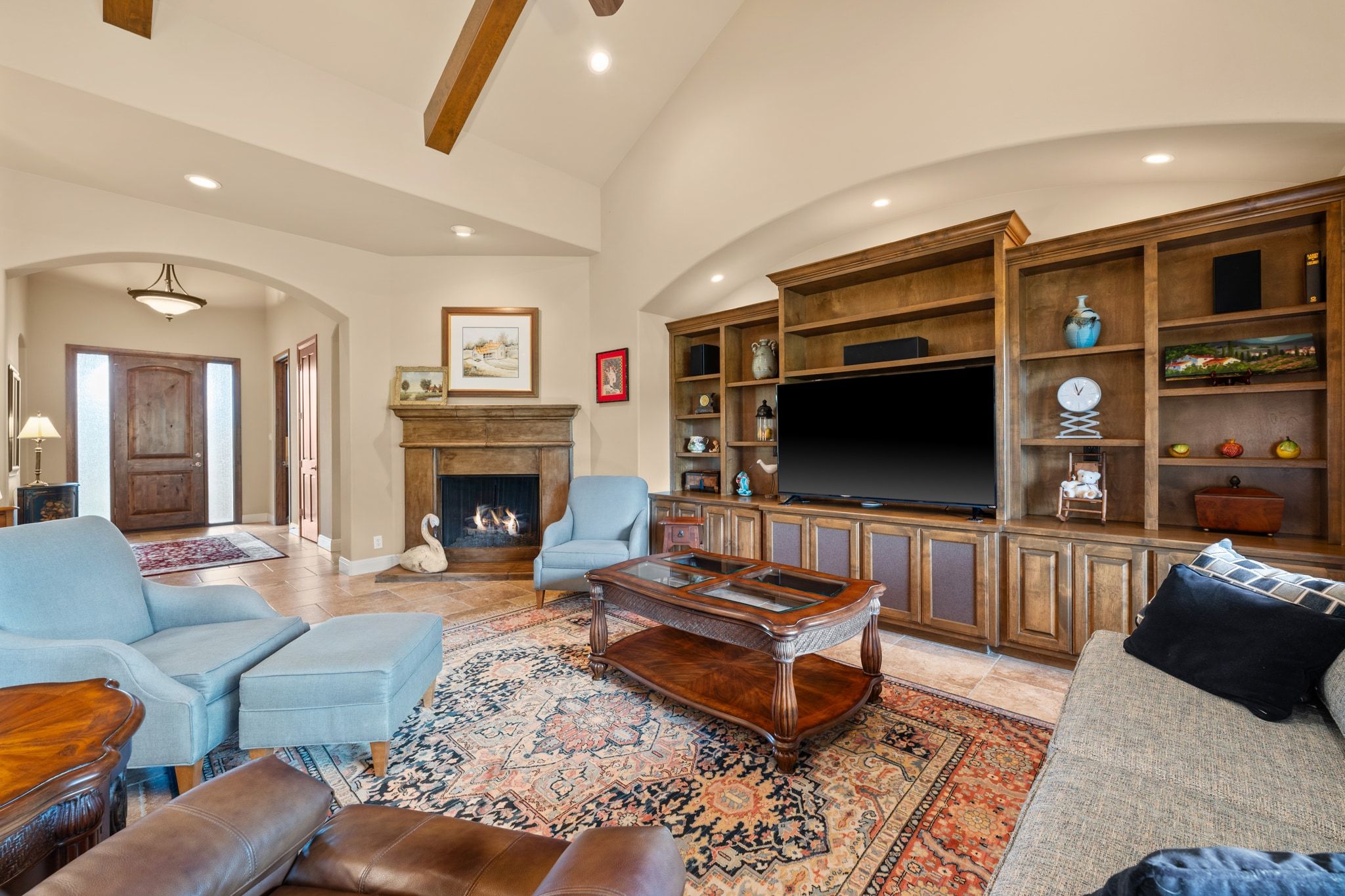 14 Borello Drive, Unit 14 Austin, TX 78738 - Photo 7 of 33 a living room with furniture a flat screen tv and a fireplace