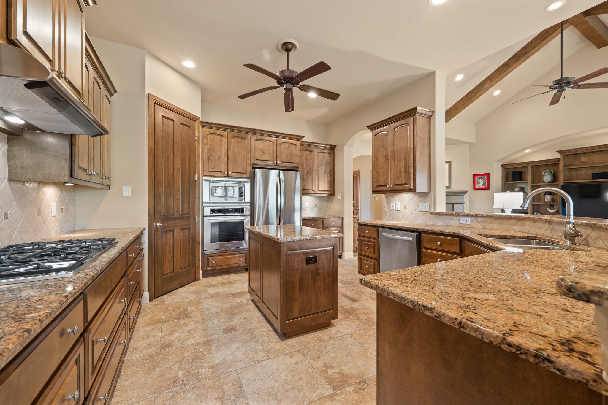 14 Borello Drive, Unit 14 Austin, TX 78738 - Photo 8 of 33 a kitchen with stainless steel appliances granite countertop a sink stove and refrigerator