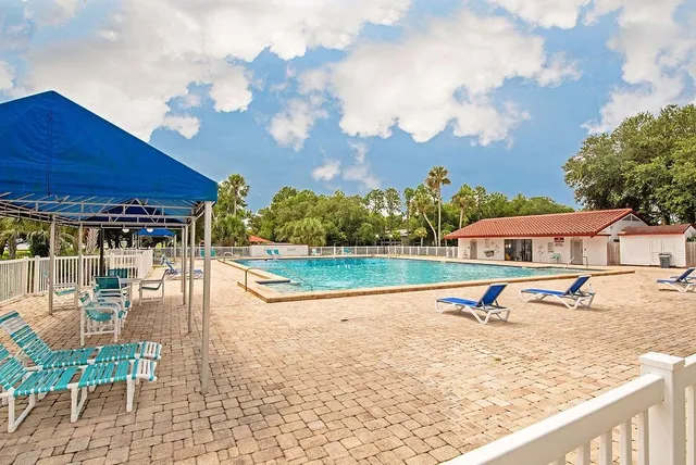 a view of a balcony with wooden floor