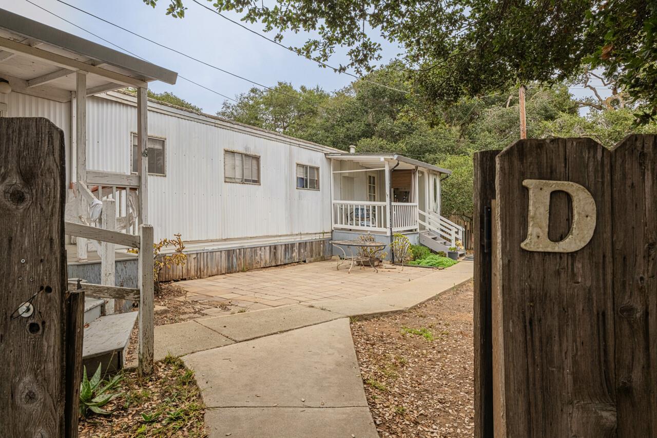 17229 McGuffie Road Prunedale, CA 93907 - Photo 8 of 9 a backyard of a house with barbeque oven and outdoor seating