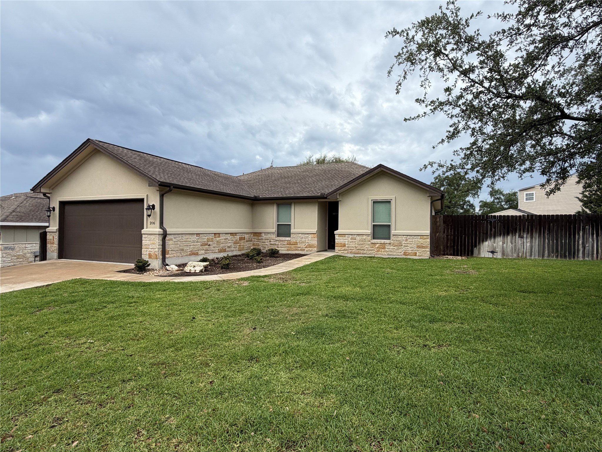 206 Fairway Circle Point Venture, TX 78645 - Photo 1 of 24 a view of a house with a yard and sitting area