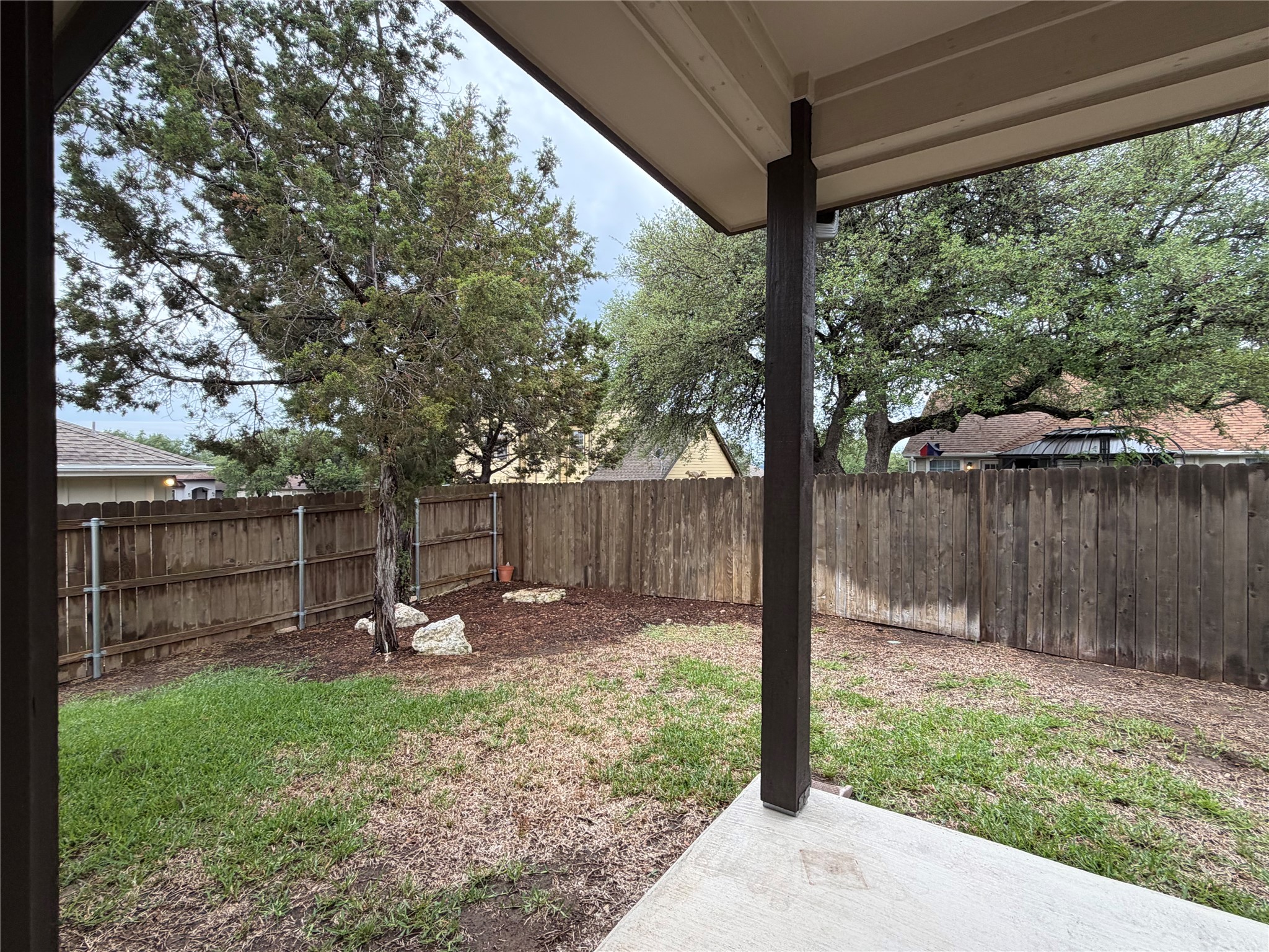 206 Fairway Circle Point Venture, TX 78645 - Photo 19 of 24 a backyard of a house with table and chairs