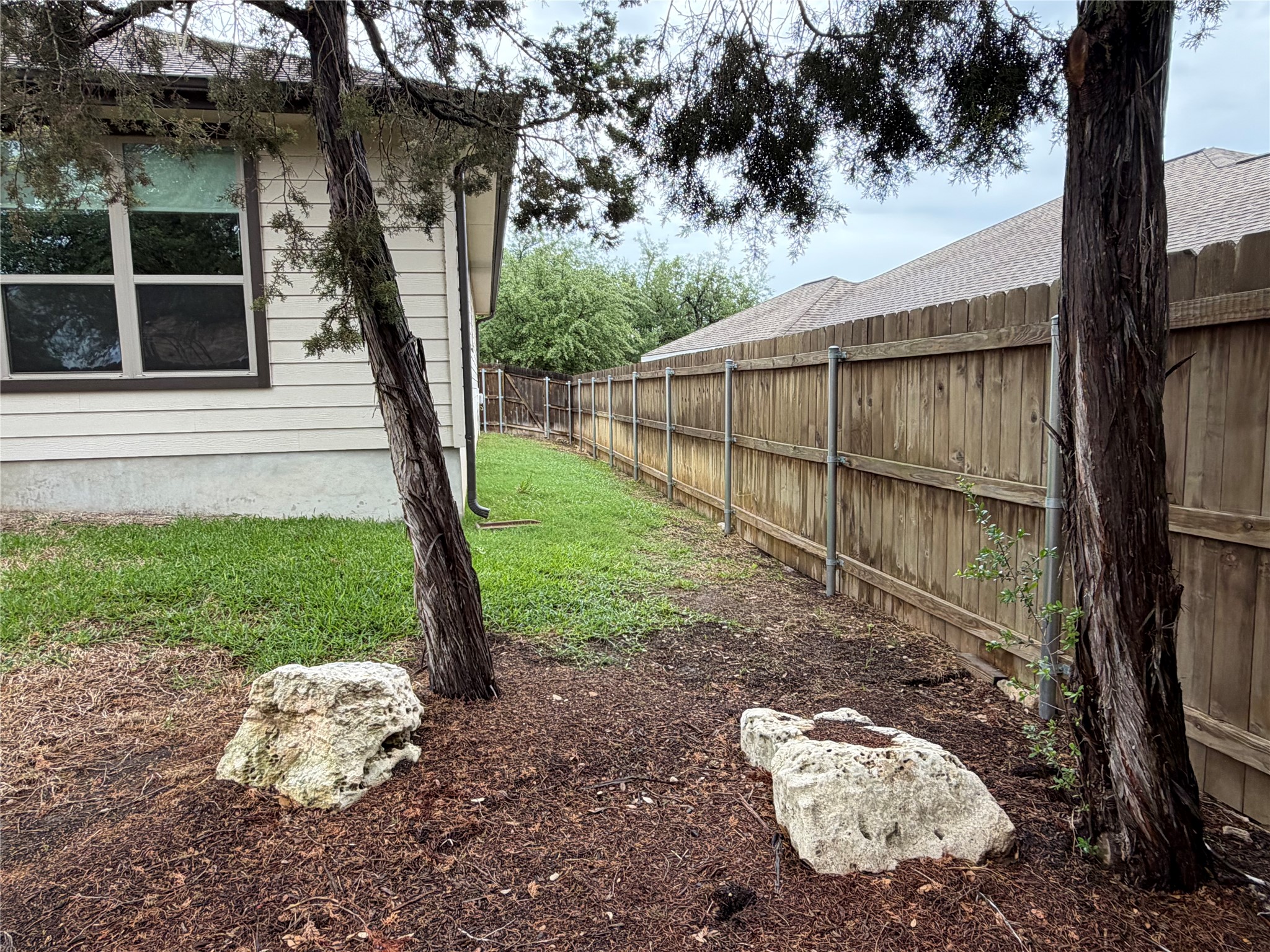 206 Fairway Circle Point Venture, TX 78645 - Photo 3 of 24 a backyard of a house with lots of green space