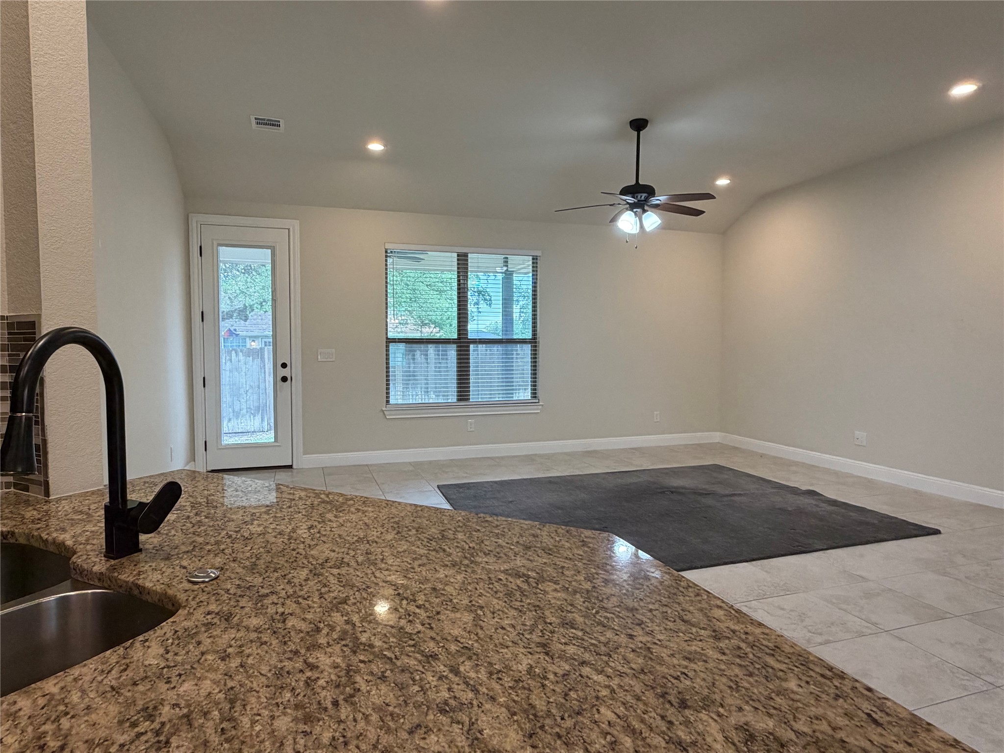 206 Fairway Circle Point Venture, TX 78645 - Photo 6 of 24 a view of a kitchen with a sink a kitchen and living room