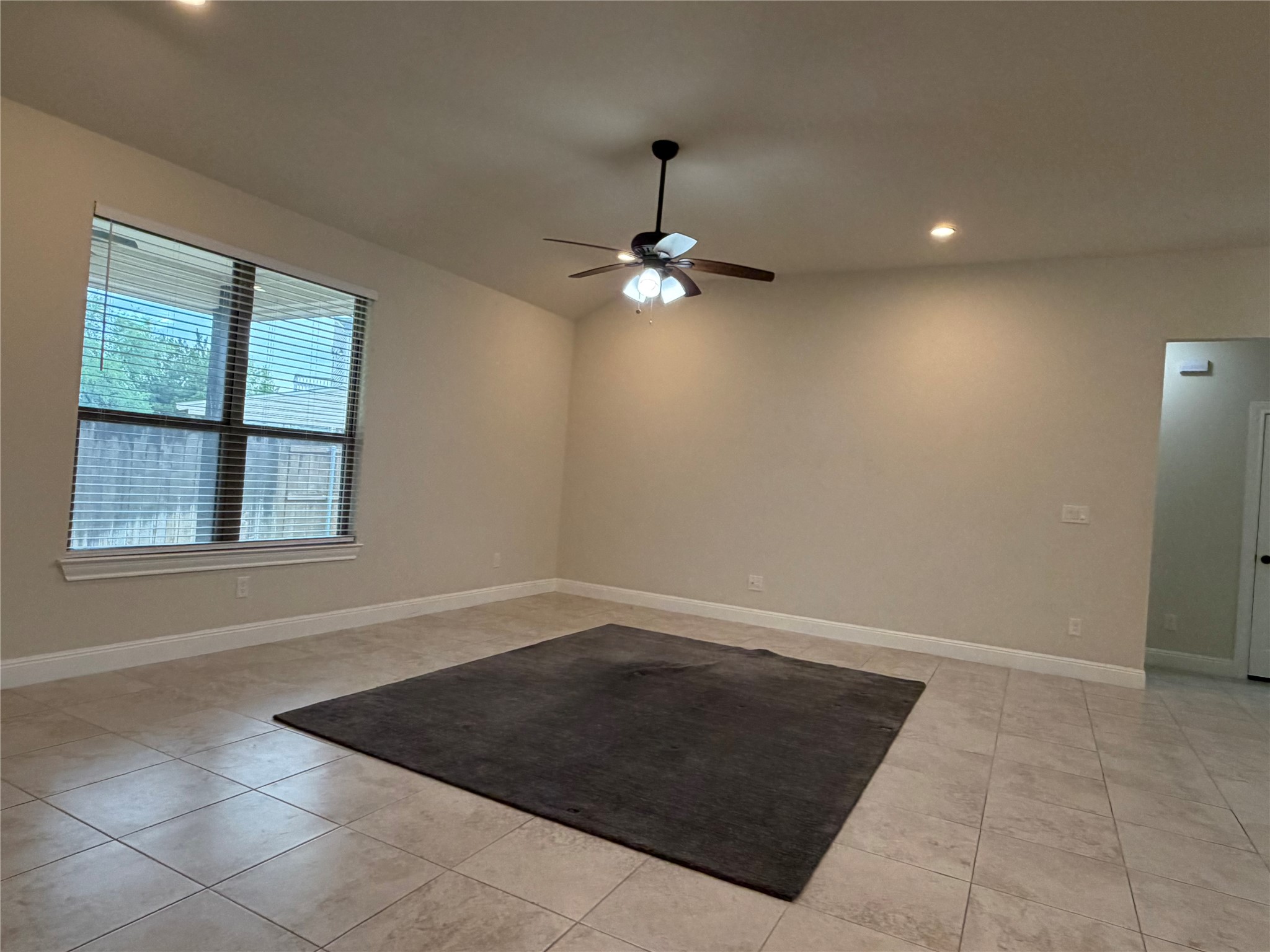 206 Fairway Circle Point Venture, TX 78645 - Photo 8 of 24 an empty room with windows and ceiling fan