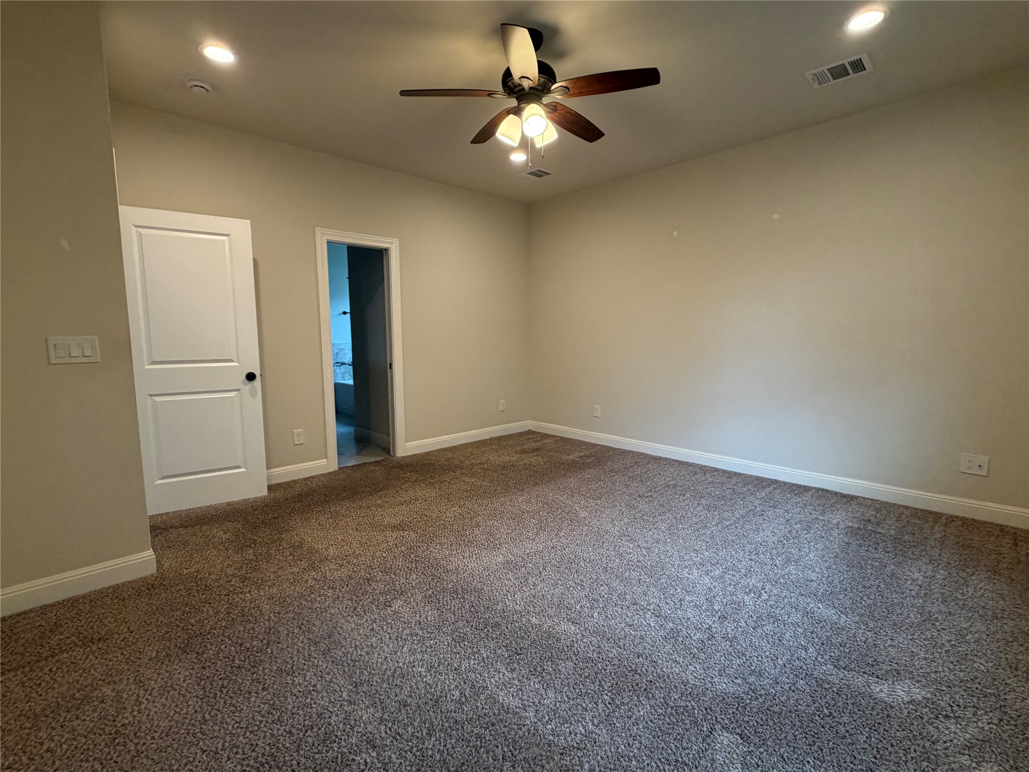 206 Fairway Circle Point Venture, TX 78645 - Photo 9 of 24 an empty room with closet and a chandelier fan