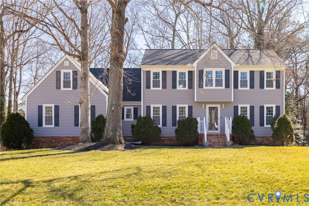 5307 Krag Road Chester, VA 23831 - Photo 1 of 49 a front view of house with yard and trees around