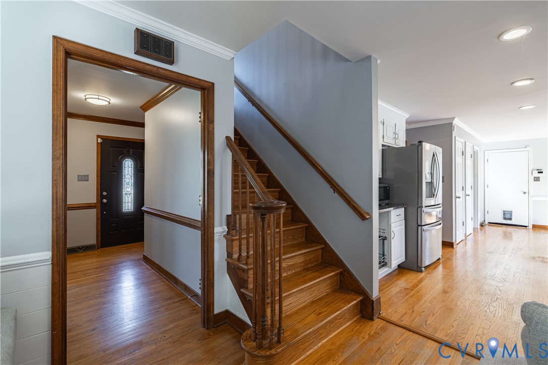 5307 Krag Road Chester, VA 23831 - Photo 20 of 49 a view of a hallway with wooden floor and staircase