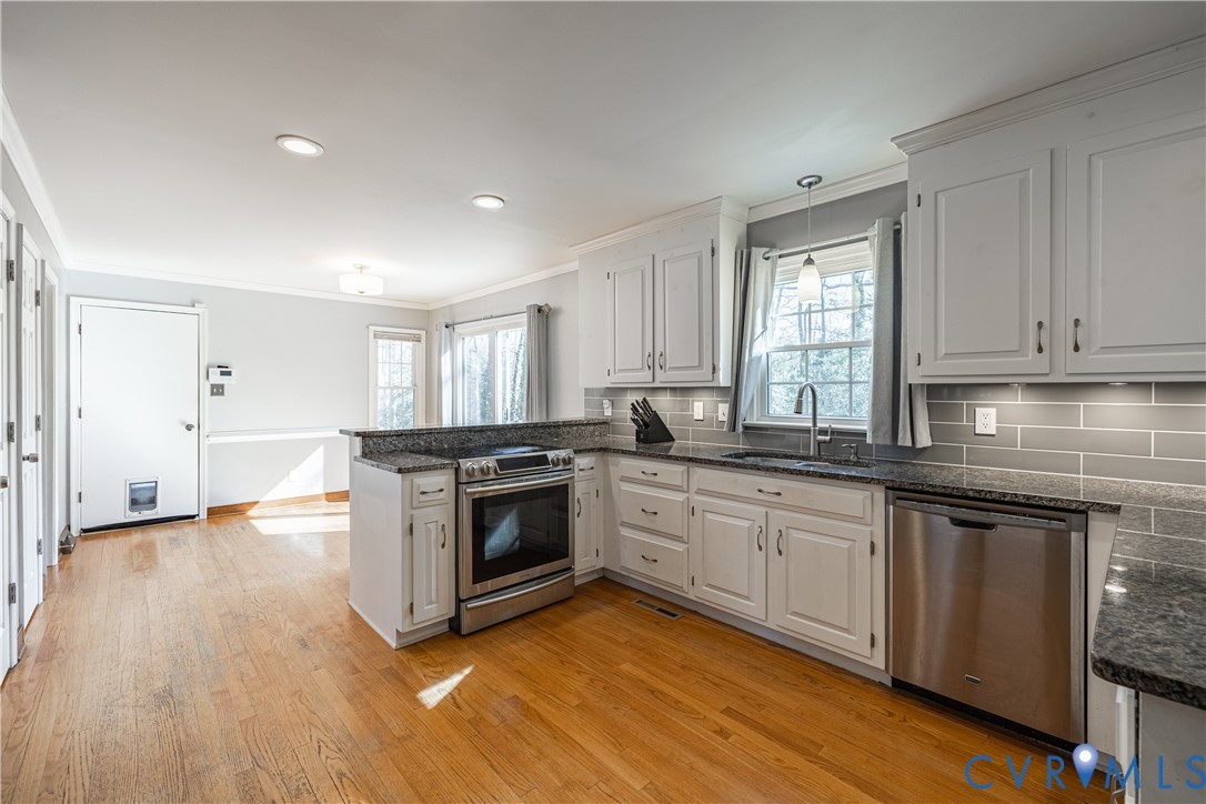 5307 Krag Road Chester, VA 23831 - Photo 22 of 49 a kitchen with granite countertop a stove and a sink