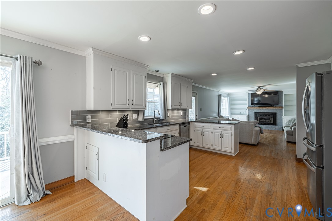 5307 Krag Road Chester, VA 23831 - Photo 25 of 49 a kitchen with a sink appliances wooden floor and a window
