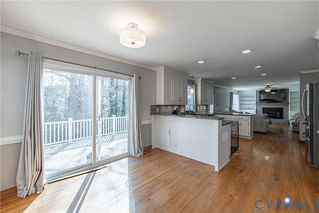 5307 Krag Road Chester, VA 23831 - Photo 26 of 49 a kitchen with stainless steel appliances granite countertop a stove top oven a sink and a refrigerator