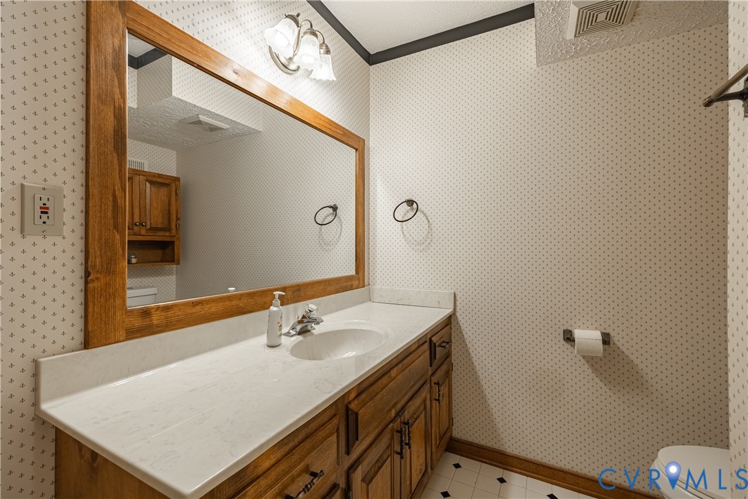 5307 Krag Road Chester, VA 23831 - Photo 31 of 49 a bathroom with a sink and a mirror