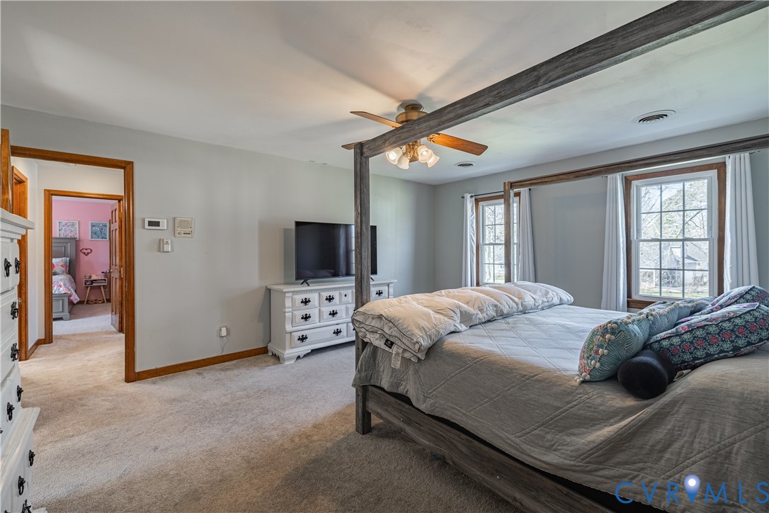 5307 Krag Road Chester, VA 23831 - Photo 37 of 49 a bedroom with a bed and a flat screen tv