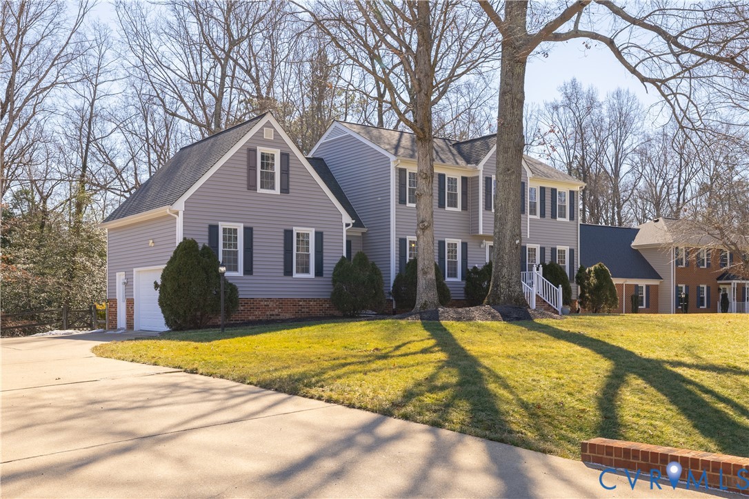 5307 Krag Road Chester, VA 23831 - Photo 4 of 49 a view of a house with a large trees in front of it