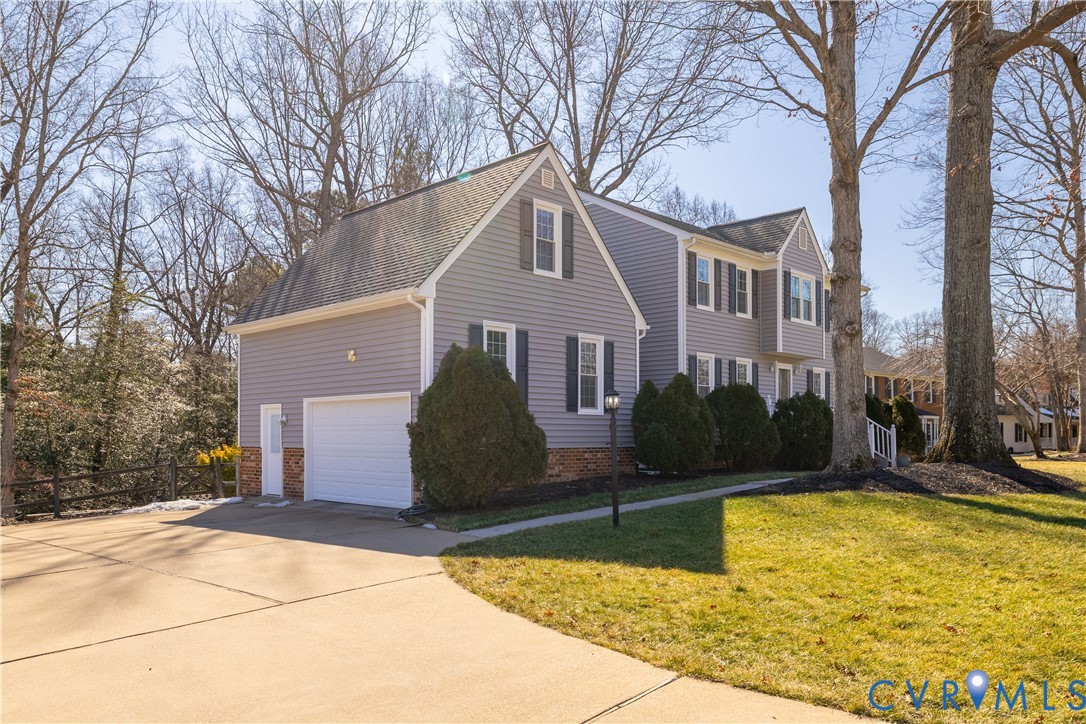 5307 Krag Road Chester, VA 23831 - Photo 5 of 49 a front view of house with yard and trees around