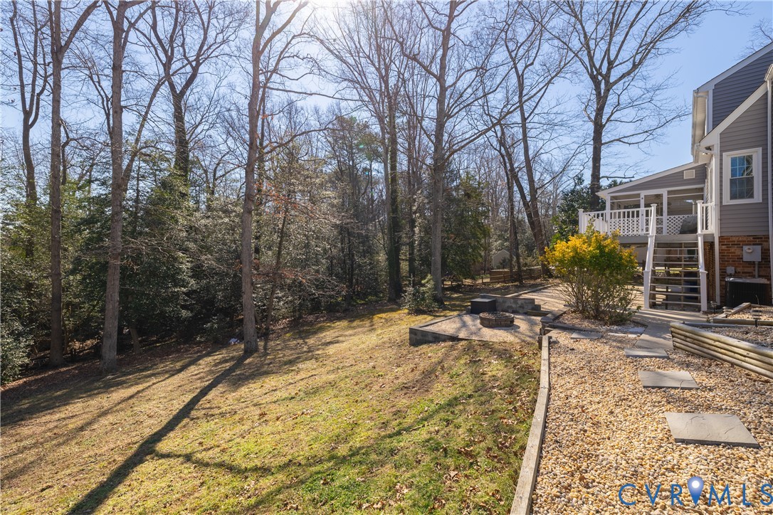 5307 Krag Road Chester, VA 23831 - Photo 7 of 49 a view of a yard with plants and trees