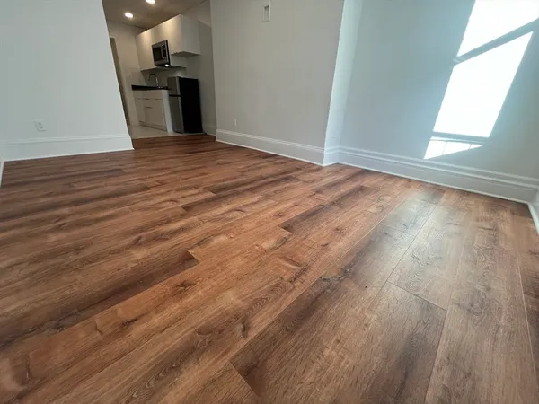 a view of a livingroom with wooden floor