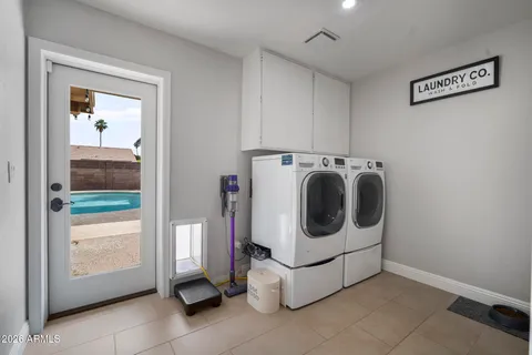 a spacious bedroom with a bed and a ceiling fan