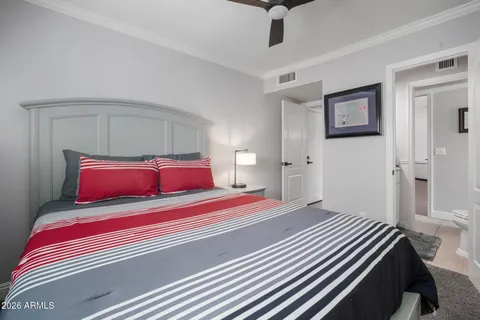 a bedroom with a workspace