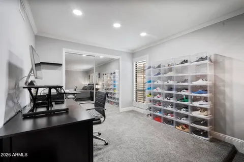 a bedroom with a bed and a ceiling fan