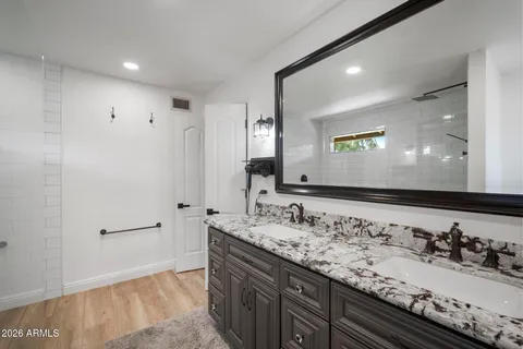 a kitchen with stainless steel appliances a refrigerator and a stove top oven