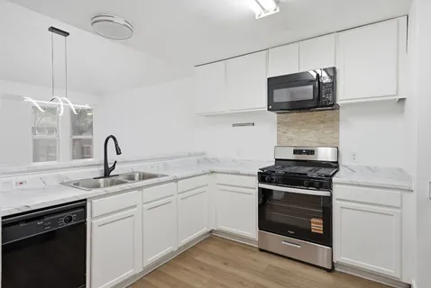 a kitchen with a stove and a microwave
