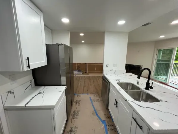 a kitchen with a sink and a refrigerator