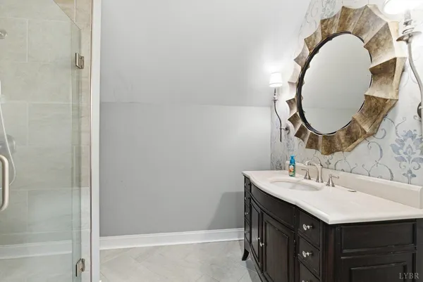 a bathroom with a sink and a mirror