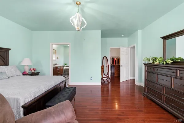 a spacious bedroom with a bed and a fireplace