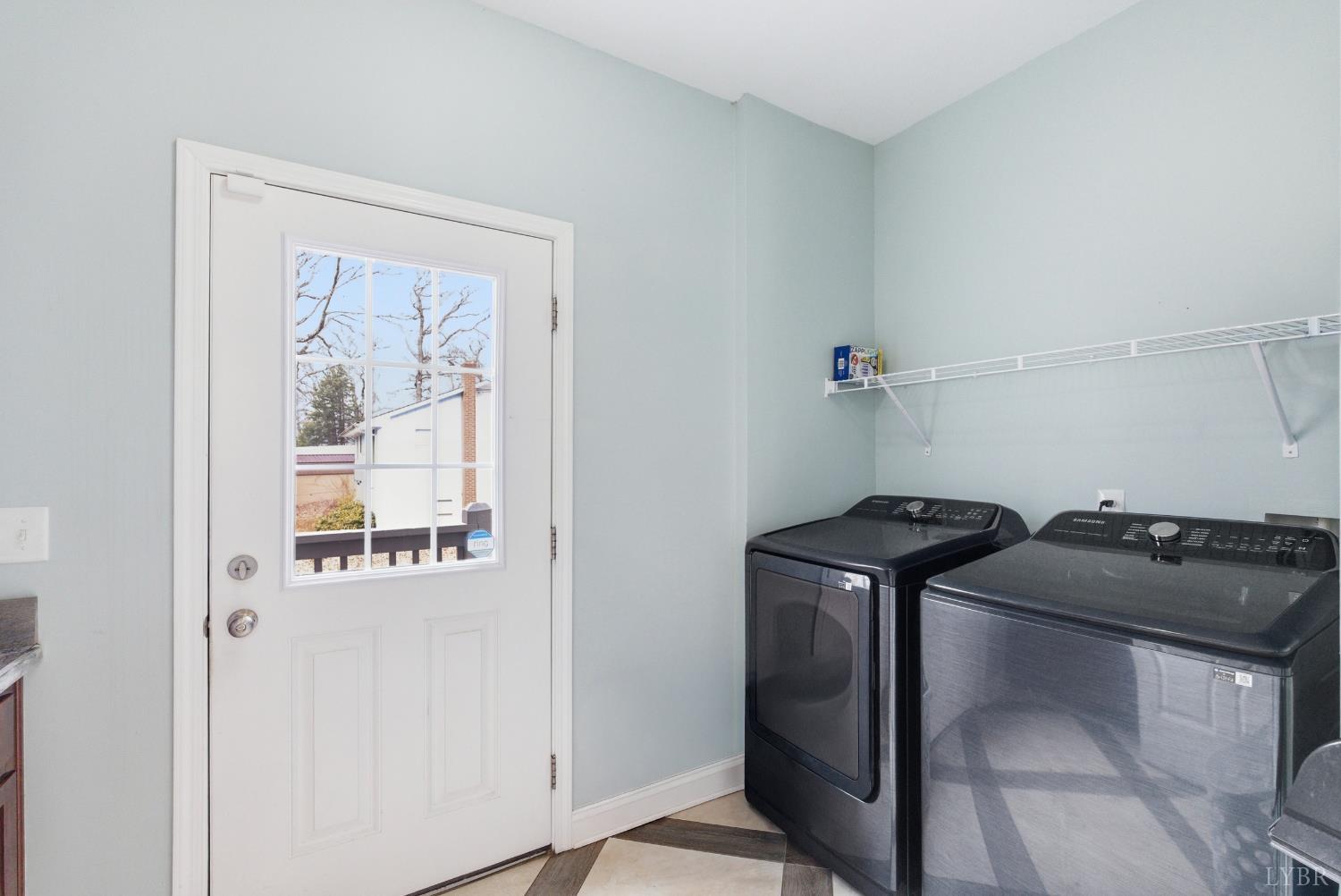 2067 Flint Hill Road Moneta, VA 24121 - Photo 23 of 70 a view of storage and utility room with washer and dryer