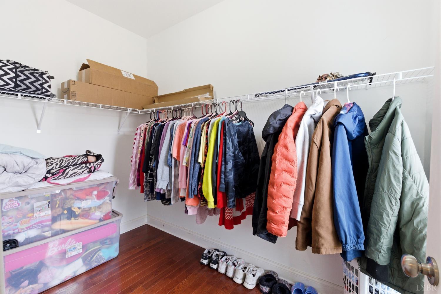 2067 Flint Hill Road Moneta, VA 24121 - Photo 30 of 70 a view of walk in closet with clothes and shoes