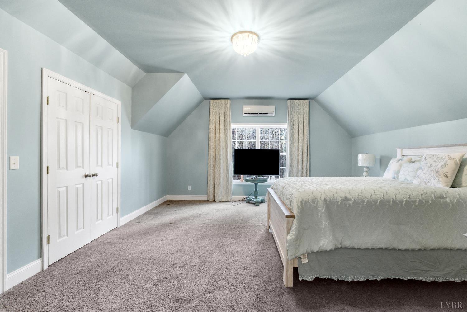 2067 Flint Hill Road Moneta, VA 24121 - Photo 35 of 70 a spacious bedroom with a bed and a fireplace
